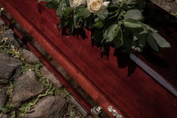 White Flowers on the Top of a Coffin