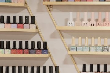 white and black bottles on brown wooden shelf